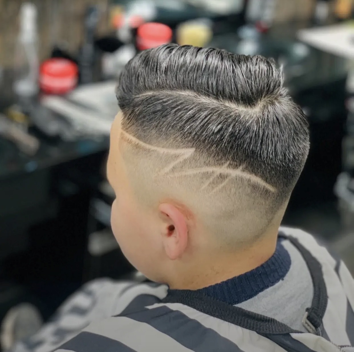 Finished haircut with detailed curved line work